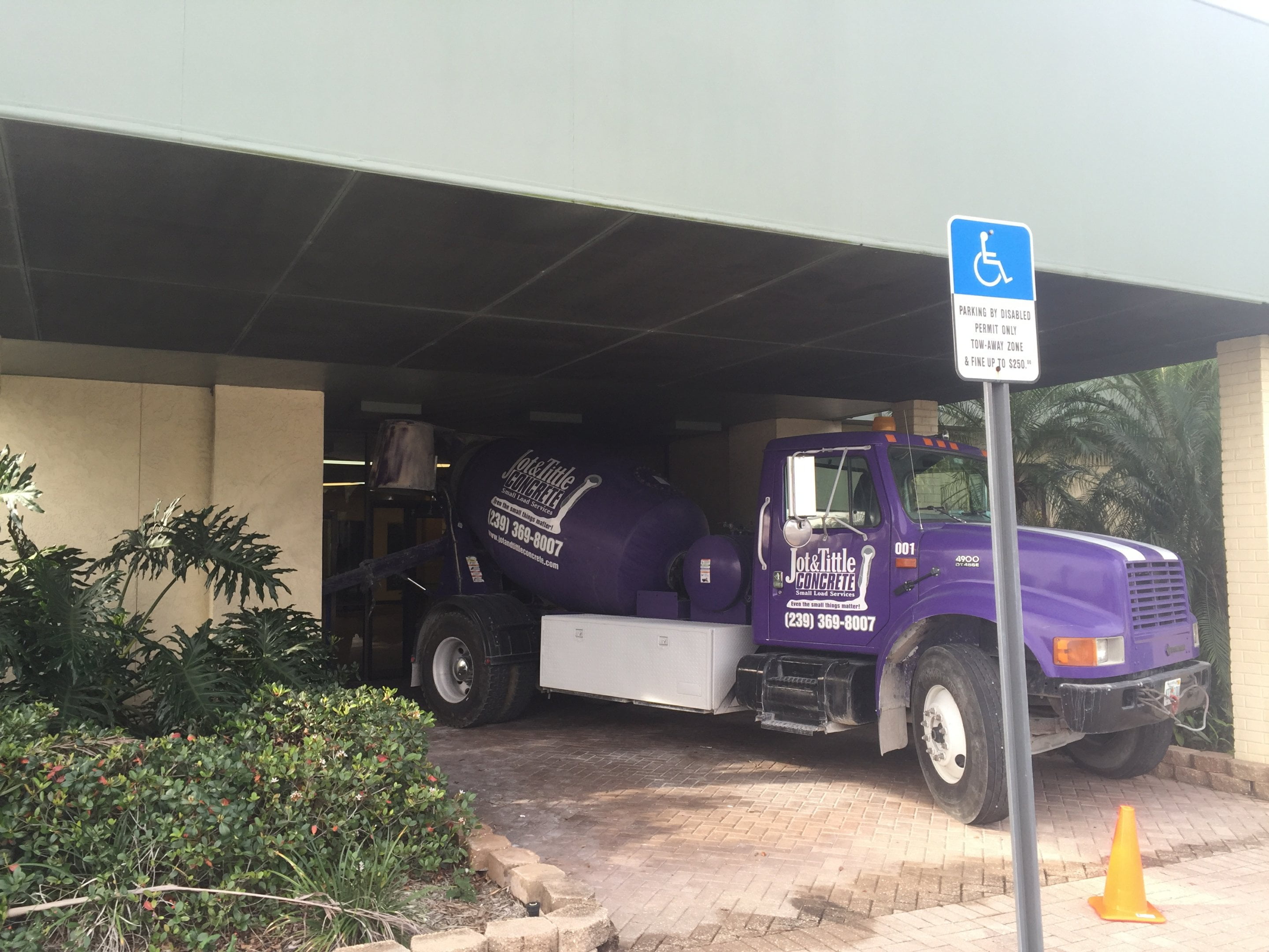 jot and tittle truck under building